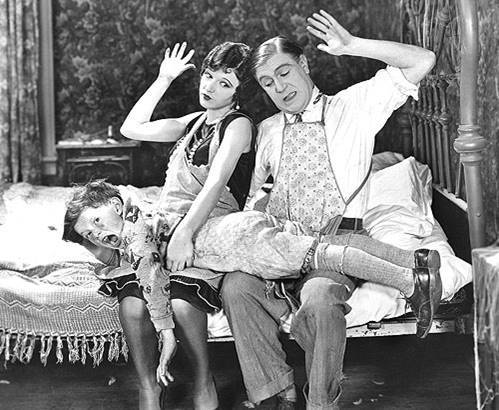 Parents spanking a boy 100 years ago